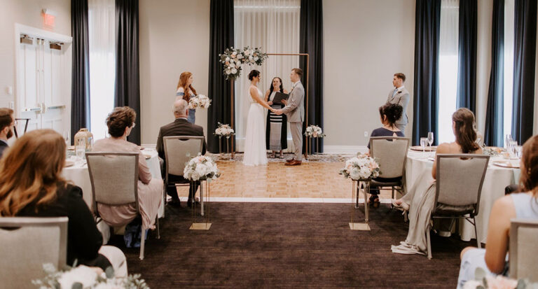 couple at the altar before a wedding