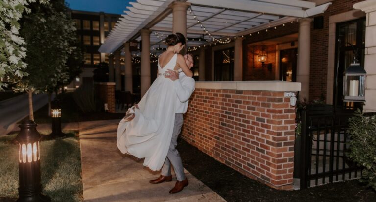 married couple spinning outside by brick patio outside